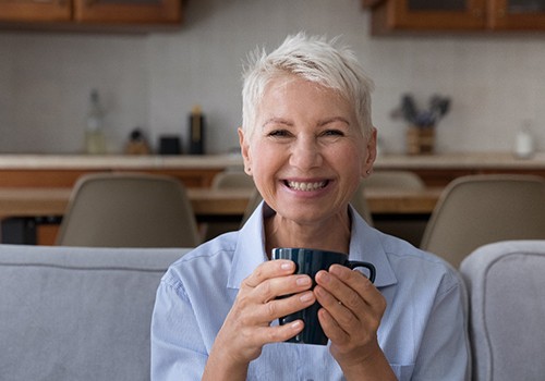 Woman smiling on a couch