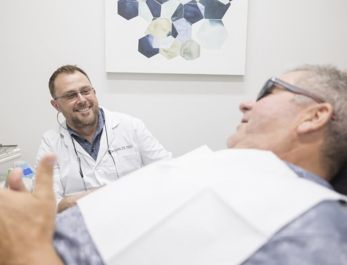 Doctor Rodda performing dental exam during preventive dentistry visit