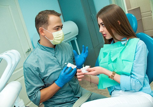 Patient in Phoenix talking to dentist about dental crowns