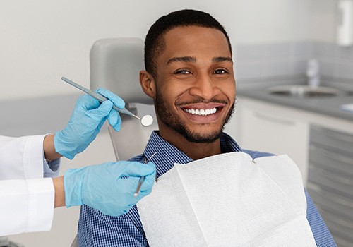 Patient in Phoenix with dental crowns smiling