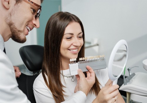 Patient in Phoenix talking to dentist about dental crowns