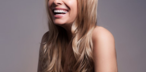 Woman laughing and enjoying her dental veneers